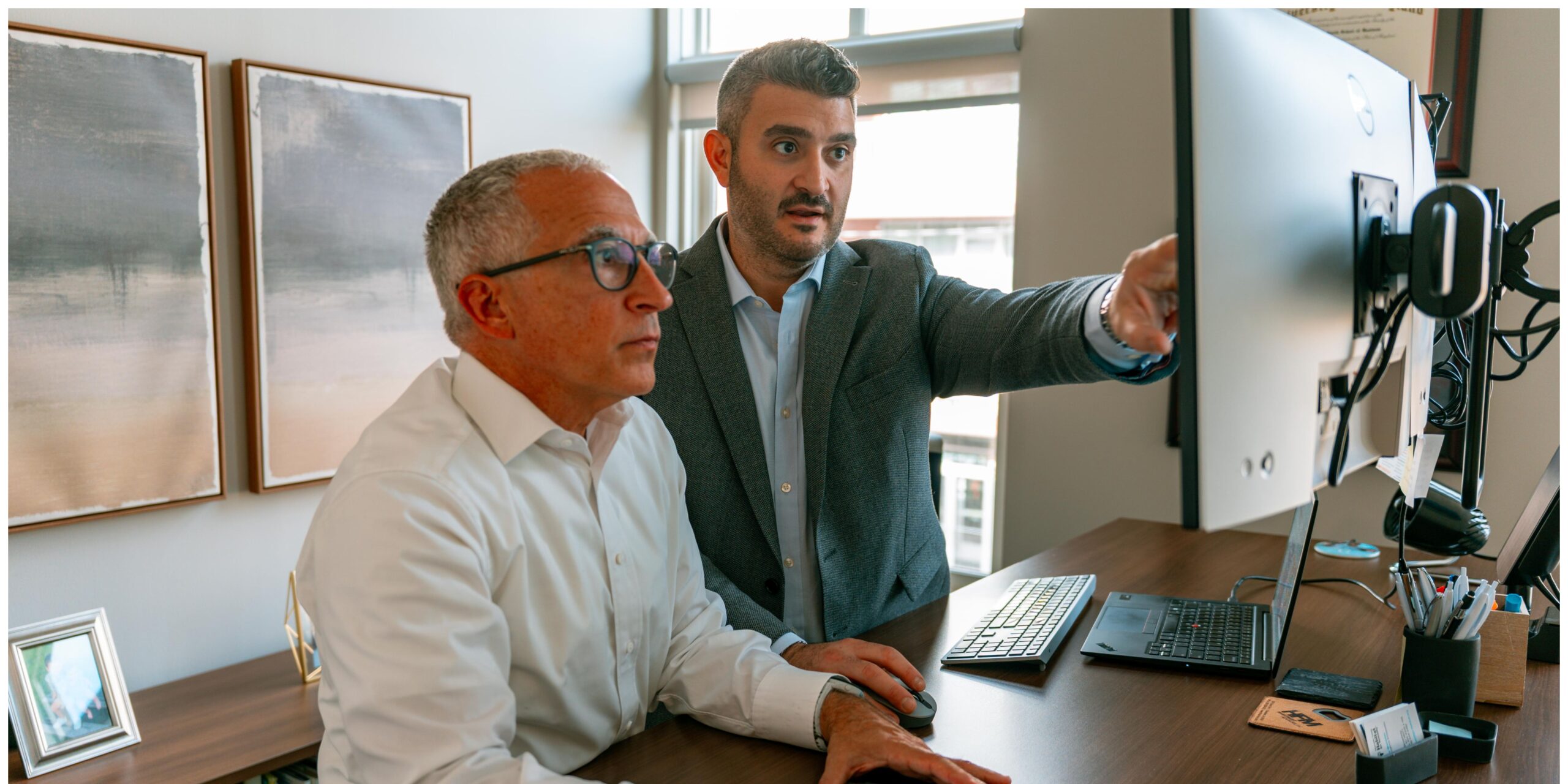 team looking at a monitor
